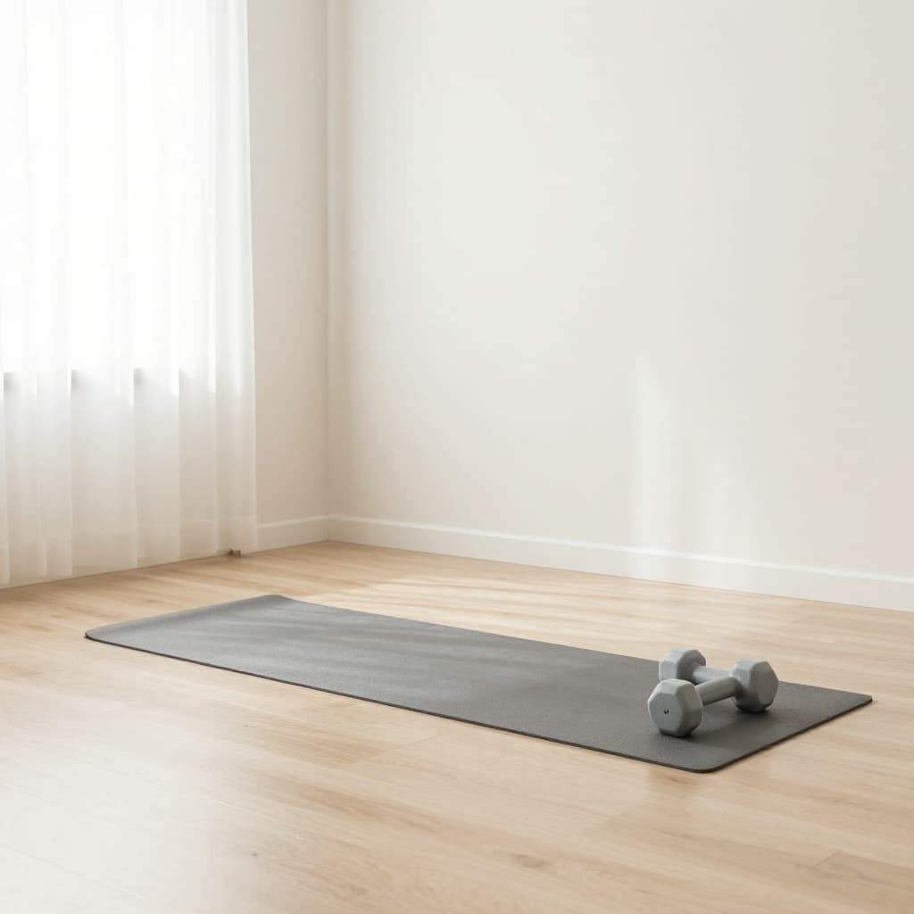 A bright, airy room features a yoga mat and light weights arranged for safe exercise.