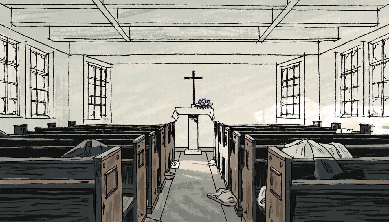 Empty church pews face a simple altar with flowers and coats on a few pew ends.