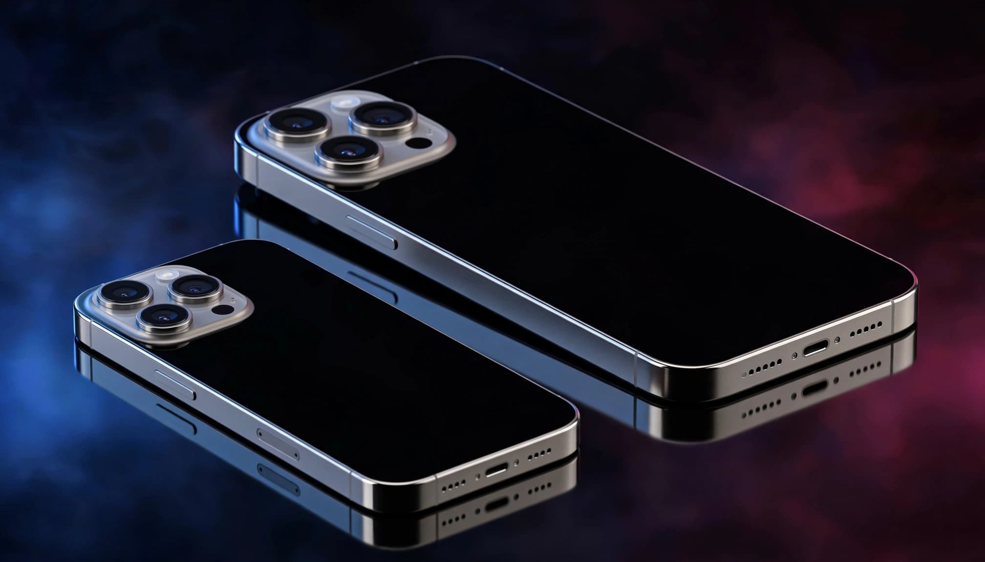 Two premium smartphones, one smaller and one larger, angled on a reflective dark surface.
