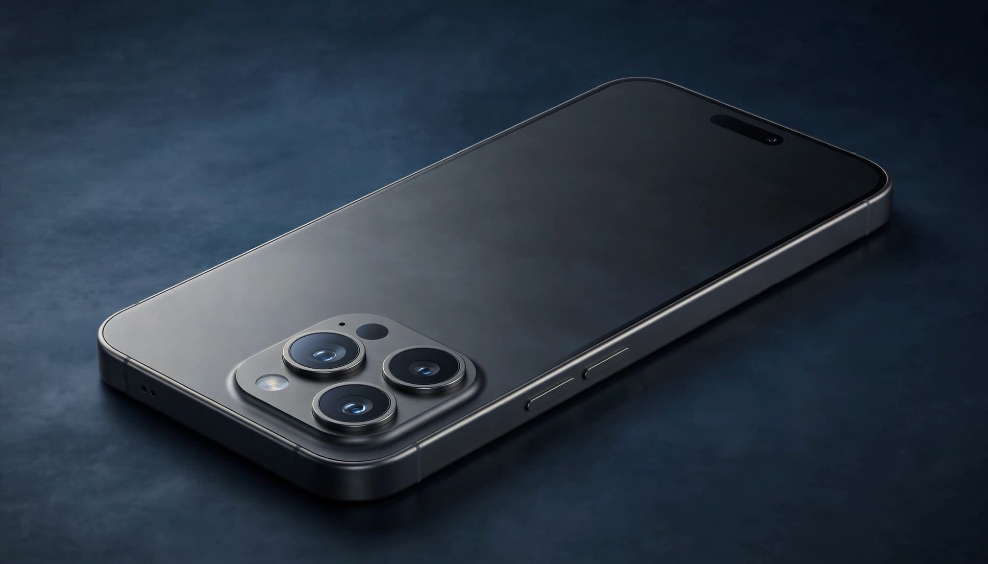 Premium smartphone angled on a dark surface with three rear cameras and a blank screen.